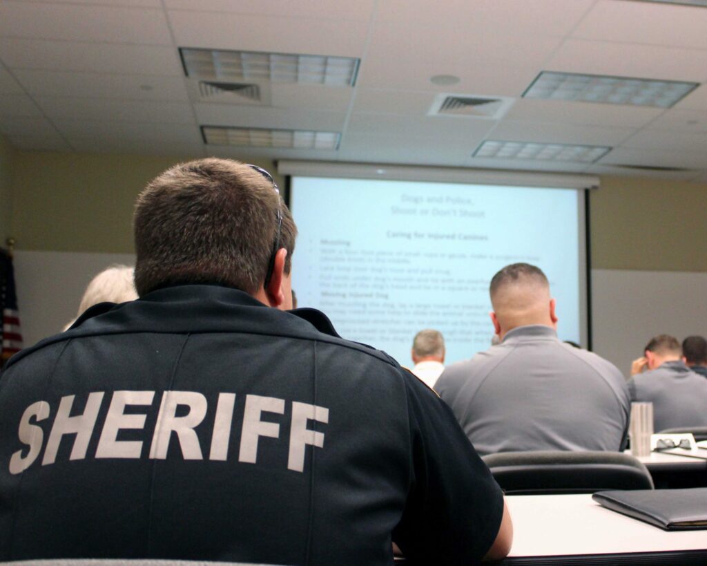 A sheriff deputy sits in a Regional Law Enforcement Academy in-service course.