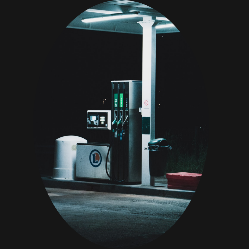 Light shines down on a gas pump during the evening