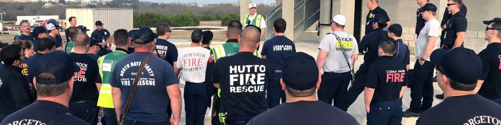 Members of various response organization get briefed about a mock disaster during a regional training exercise in late 2018.