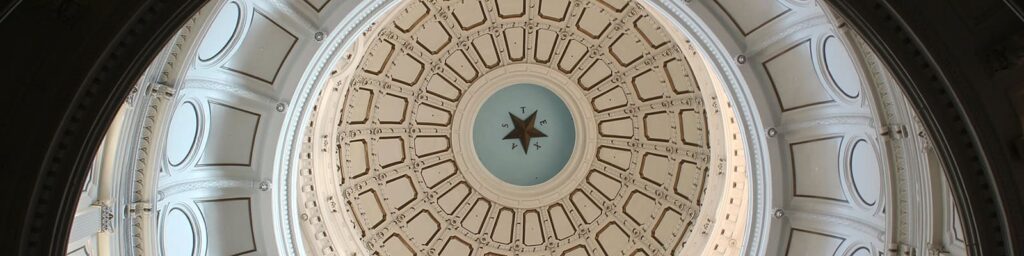 The Texas Capitol Rotunda stands above the hallway in the capitol building