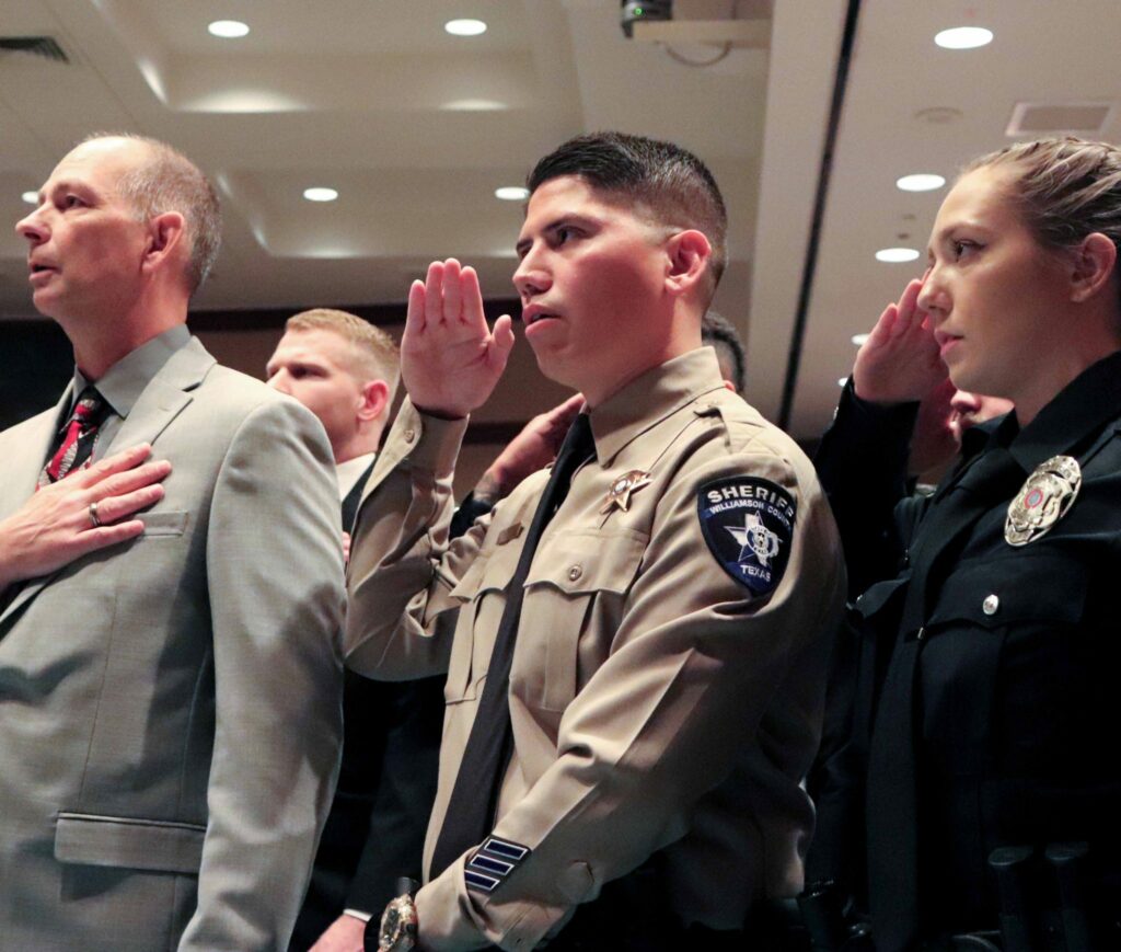 officer saluting during ceremony