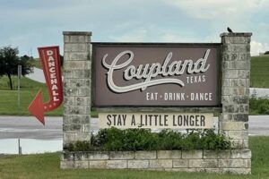 The welcome sign for Coupland, Texas.